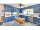This eat-in kitchen features custom blue cabinetry, white countertops, and stainless steel appliances at 3000 Imperial Dr, Gastonia, NC 28054