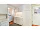 This well-lit laundry room features tiled floors and white cabinets at 3000 Imperial Dr, Gastonia, NC 28054