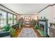 Bright living room with hardwood floors, built-in bookshelves, a fireplace, and ample natural light at 3000 Imperial Dr, Gastonia, NC 28054