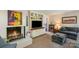 Comfortable living room with a fireplace, built-in shelves, and a cozy seating arrangement at 3000 Imperial Dr, Gastonia, NC 28054