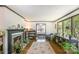 Inviting living room with hardwood floors, a fireplace, built-in shelving, and abundant natural light at 3000 Imperial Dr, Gastonia, NC 28054