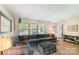 Cozy living room with a large sectional sofa, natural light, and comfortable atmosphere at 3000 Imperial Dr, Gastonia, NC 28054