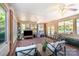 Spacious sunroom with brick flooring, a ceiling fan and lots of natural light at 3000 Imperial Dr, Gastonia, NC 28054