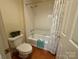 Bathroom with a tiled shower and tub at 3011 Lakewood Edge Dr, Charlotte, NC 28269