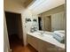 Bathroom vanity with sink and large mirror at 3011 Lakewood Edge Dr, Charlotte, NC 28269