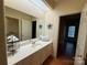 Bathroom vanity with sink and large mirror at 3011 Lakewood Edge Dr, Charlotte, NC 28269
