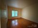 Bedroom with window and hardwood flooring at 3011 Lakewood Edge Dr, Charlotte, NC 28269