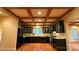 The kitchen features wooden floors, dark cabinets, light countertops and stainless steel appliances at 3011 Lakewood Edge Dr, Charlotte, NC 28269