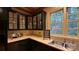 A well-lit kitchen features dark cabinets, light countertops, and a stainless steel sink by a window at 3011 Lakewood Edge Dr, Charlotte, NC 28269