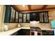 The gourmet kitchen is equipped with stainless steel appliances and glass-front cabinets at 3011 Lakewood Edge Dr, Charlotte, NC 28269