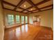 This spacious room has hardwood floors, a coffered ceiling, and large windows at 3011 Lakewood Edge Dr, Charlotte, NC 28269