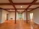 Open-concept living space with hardwood floors and exposed wood beams at 3011 Lakewood Edge Dr, Charlotte, NC 28269
