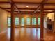 Spacious living room featuring hardwood floors, fireplace, and a wall of windows at 3011 Lakewood Edge Dr, Charlotte, NC 28269