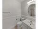 Clean bathroom with classic vanity, neutral tile floor, and bright natural light at 3114 Parker Green Trl, Charlotte, NC 28269
