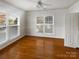 Charming bedroom with hardwood floors and natural light streaming through two large windows at 3114 Parker Green Trl, Charlotte, NC 28269