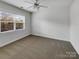 Bright bedroom with neutral carpet and natural light from a large window at 3114 Parker Green Trl, Charlotte, NC 28269