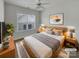 Cozy bedroom with natural light, neutral colors, ceiling fan and modern decor at 3114 Parker Green Trl, Charlotte, NC 28269