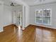Inviting living room with hardwood floors, large windows, and elegant architectural details at 3114 Parker Green Trl, Charlotte, NC 28269