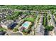 An aerial view of a community featuring lush greenery, a sparkling pool, and a playground for its residents at 3214 Park South Station Blvd, Charlotte, NC 28210