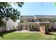 Charming home with a well-manicured lawn, fenced-in backyard, and a concrete patio perfect for outdoor gatherings at 3214 Park South Station Blvd, Charlotte, NC 28210