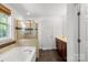 Bathroom featuring a walk-in shower and a large tub at 3214 Park South Station Blvd, Charlotte, NC 28210