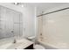 Bathroom featuring a single vanity, mirror, and shower-tub combo at 3214 Park South Station Blvd, Charlotte, NC 28210