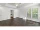This bedroom has hardwood floors, a ceiling fan and an ensuite bathroom at 3214 Park South Station Blvd, Charlotte, NC 28210
