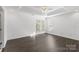This bedroom features hardwood floors, bright natural light and a ceiling fan at 3214 Park South Station Blvd, Charlotte, NC 28210