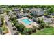 Breathtaking aerial shot of a community pool and clubhouse nestled among lush trees, creating a perfect oasis at 3214 Park South Station Blvd, Charlotte, NC 28210