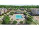Stunning aerial view of a community pool and clubhouse surrounded by lush landscaping and well-maintained grounds at 3214 Park South Station Blvd, Charlotte, NC 28210