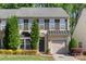 Well maintained exterior of home with shutters, manicured shrubbery, gray roof and an attached one car garage at 3214 Park South Station Blvd, Charlotte, NC 28210