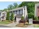 Charming two-story home with well-maintained landscaping, shutters, and an attached garage in a tree-lined neighborhood at 3214 Park South Station Blvd, Charlotte, NC 28210
