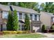 Charming two-story home with well-maintained landscaping, shutters, and an attached garage in a tree-lined neighborhood at 3214 Park South Station Blvd, Charlotte, NC 28210