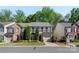 Charming two-story home with well-maintained landscaping, shutters, and an attached garage in a tree-lined neighborhood at 3214 Park South Station Blvd, Charlotte, NC 28210