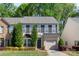 Charming two-story home with well-maintained landscaping, shutters, and an attached garage in a tree-lined neighborhood at 3214 Park South Station Blvd, Charlotte, NC 28210