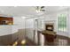Large open living area with a stone fireplace and dark hardwood floors at 3214 Park South Station Blvd, Charlotte, NC 28210
