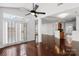 Open living area with hardwood floors, a ceiling fan, and a view into the kitchen at 3214 Park South Station Blvd, Charlotte, NC 28210