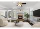 Inviting living room showcases a stone fireplace, dark wood floors and neutral decor at 3214 Park South Station Blvd, Charlotte, NC 28210