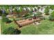 Aerial view of a playground featuring modern equipment, picnic tables, and a well-maintained lawn in a serene setting at 3214 Park South Station Blvd, Charlotte, NC 28210