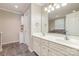 Bathroom featuring double vanity sinks, decorative lighting, and tile floors at 3248 Park South Station Blvd, Charlotte, NC 28210