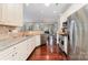 Well-lit kitchen featuring stainless steel appliances, granite countertops, and hardwood floors at 3248 Park South Station Blvd, Charlotte, NC 28210