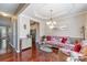 Comfortable living room with hardwood flooring and views into the kitchen at 3248 Park South Station Blvd, Charlotte, NC 28210