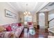 Cozy living room featuring hardwood floors, neutral walls, large windows, and traditional decor at 3248 Park South Station Blvd, Charlotte, NC 28210