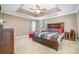 Spacious main bedroom with tray ceiling, carpet floors and ample natural light at 3248 Park South Station Blvd, Charlotte, NC 28210