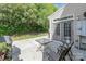 Back patio features a table, chairs, and grill at 3248 Park South Station Blvd, Charlotte, NC 28210