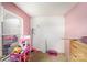 Empty pink bedroom with natural light and storage at 3882 Shasta Cir, Clover, SC 29710
