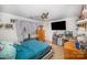 Cozy bedroom features a ceiling fan, television, dresser, and gray curtains at 3882 Shasta Cir, Clover, SC 29710