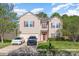 Traditional two-story home featuring neutral siding, red shutters and door, and a two-car attached garage at 3882 Shasta Cir, Clover, SC 29710