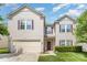 Charming two-story home features a two-car garage, landscaped yard, and inviting entrance at 3882 Shasta Cir, Clover, SC 29710