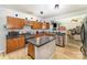 Bright kitchen with wood cabinets, stainless steel appliances, and a functional island at 3882 Shasta Cir, Clover, SC 29710